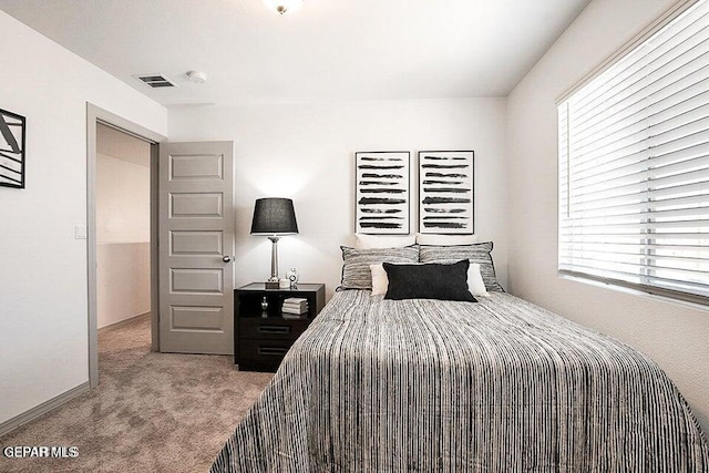bedroom featuring carpet and visible vents