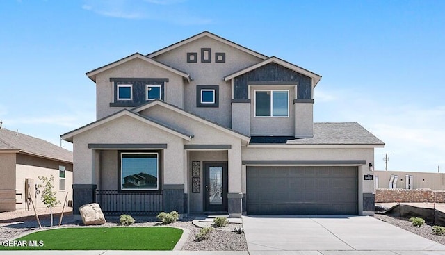 view of front facade with stucco siding and concrete driveway