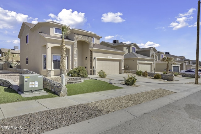 view of front of property featuring a residential view, stucco siding, driveway, and a garage