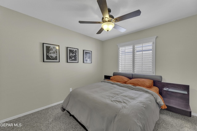 bedroom with ceiling fan, baseboards, and carpet