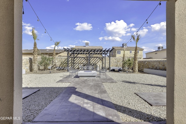 view of patio with a pergola and a fenced backyard