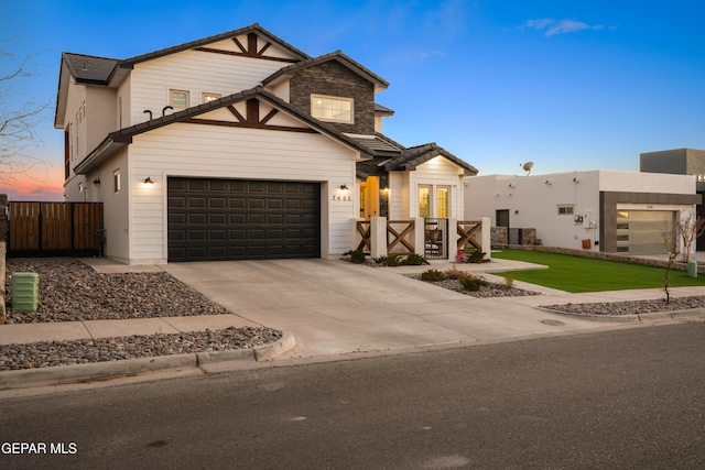 7402 Wooden Nickel Dr, El Paso, TX 79911 - view of front of home featuring fence, a garage, and concrete driveway