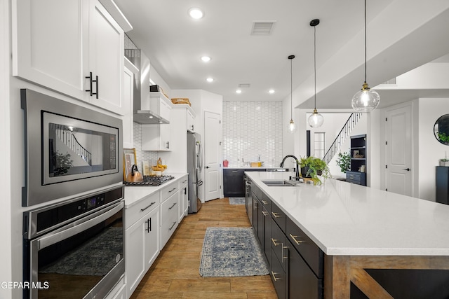 7402 Wooden Nickel Dr, El Paso, TX 79911 - kitchen featuring white cabinets, a sink, appliances with stainless steel finishes, and visible vents