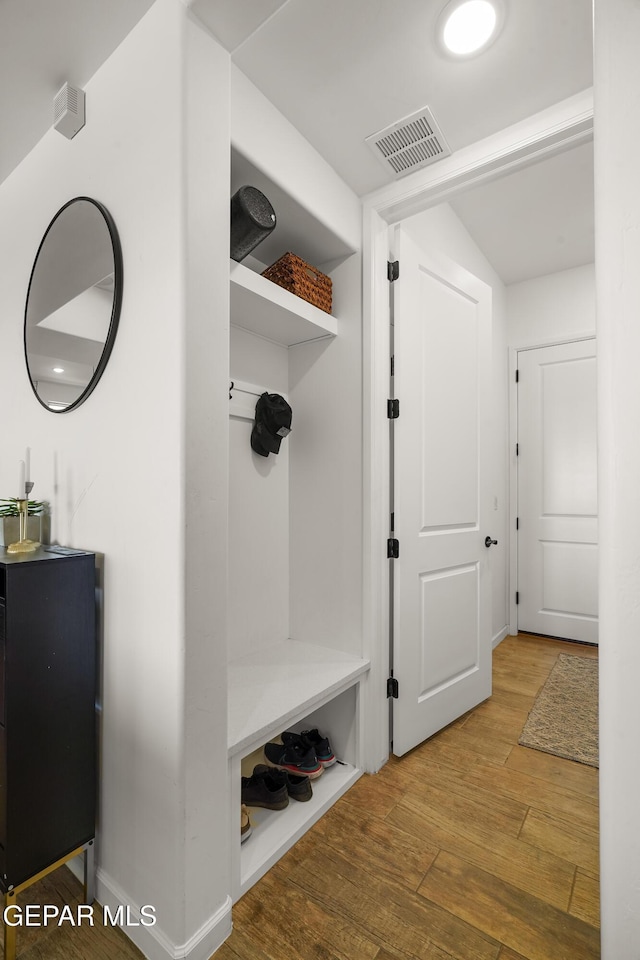7402 Wooden Nickel Dr, El Paso, TX 79911 - mudroom featuring hardwood / wood-style flooring, baseboards, and visible vents
