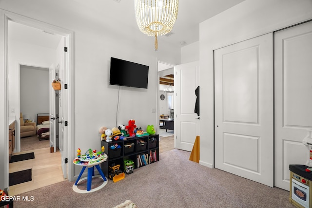 7402 Wooden Nickel Dr, El Paso, TX 79911 - game room with a notable chandelier and carpet