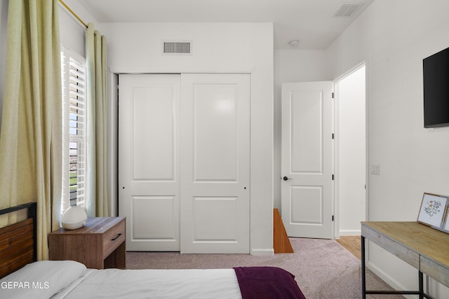 7402 Wooden Nickel Dr, El Paso, TX 79911 - bedroom with baseboards, visible vents, a closet, and carpet floors