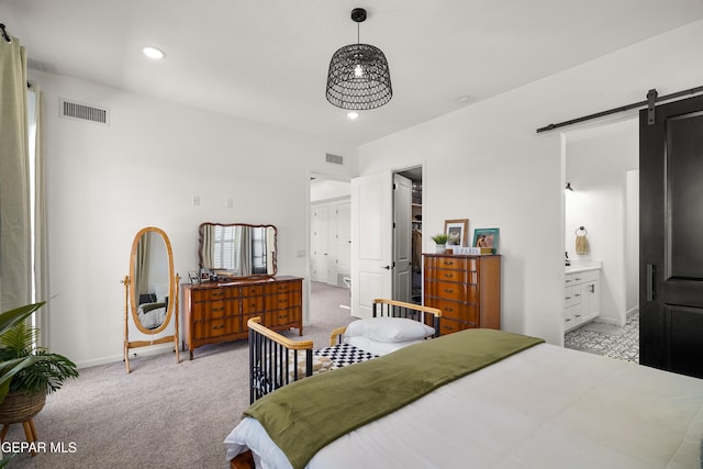 7402 Wooden Nickel Dr, El Paso, TX 79911 - bedroom with recessed lighting, visible vents, a barn door, and carpet