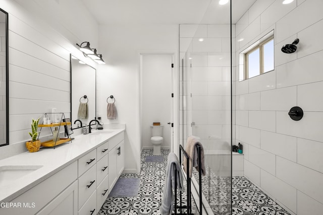 7402 Wooden Nickel Dr, El Paso, TX 79911 - full bath featuring a stall shower, double vanity, toilet, and a sink