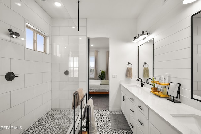 7402 Wooden Nickel Dr, El Paso, TX 79911 - bathroom with ensuite bathroom, double vanity, a walk in shower, and a sink