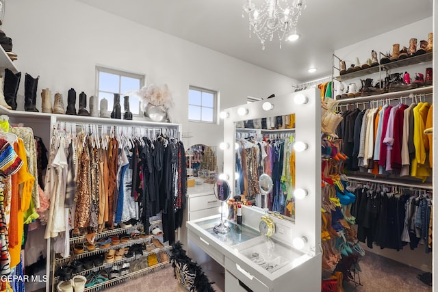 7402 Wooden Nickel Dr, El Paso, TX 79911 - walk in closet with carpet flooring and a chandelier