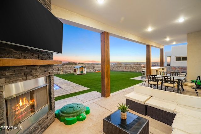 7402 Wooden Nickel Dr, El Paso, TX 79911 - view of patio featuring an outdoor living space with a fireplace and outdoor dining area