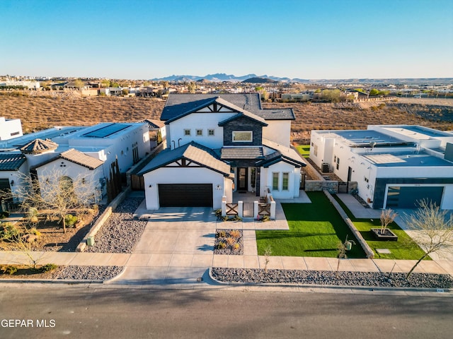 7402 Wooden Nickel Dr, El Paso, TX 79911 - modern farmhouse style home with a tiled roof, driveway, fence, and a mountain view
