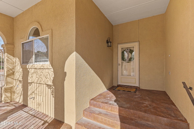 property entrance featuring stucco siding