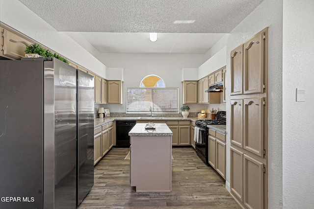 kitchen featuring a sink, black appliances, dark wood-style floors, and under cabinet range hood