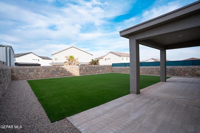 view of yard featuring a patio and a fenced backyard
