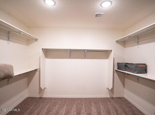 walk in closet with carpet flooring and visible vents