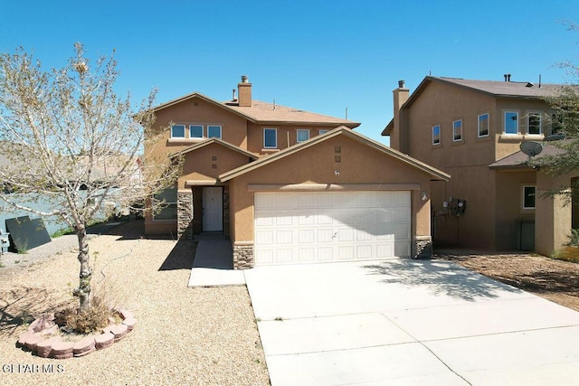 view of front facade featuring stone siding, a garage, driveway, and stucco siding