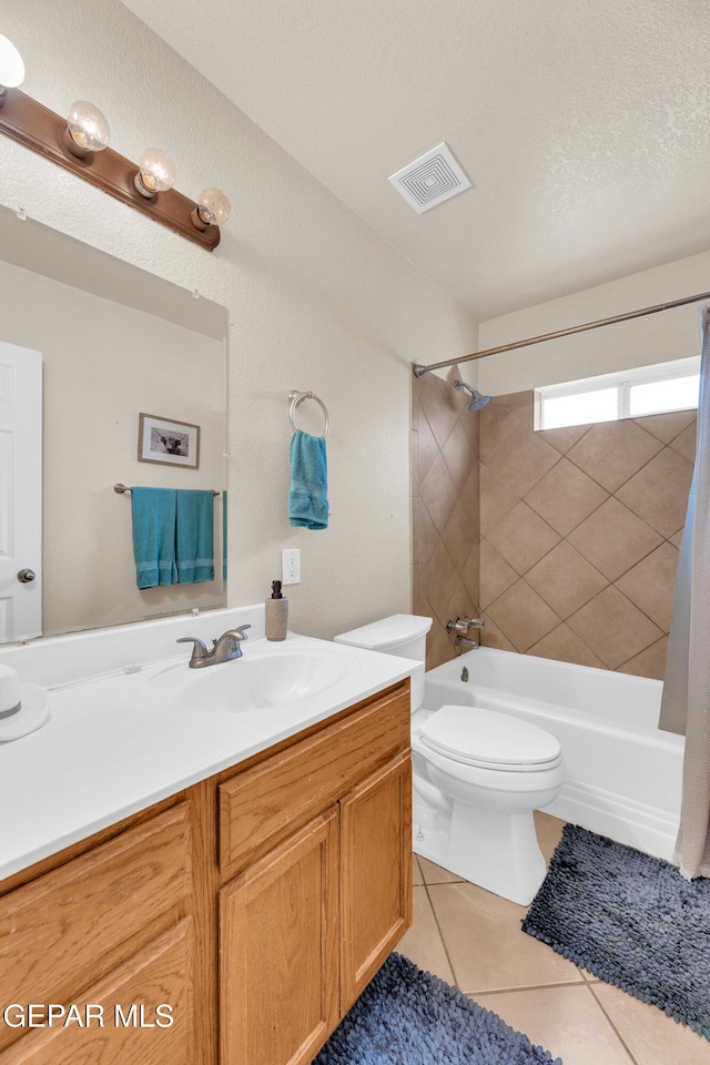 full bath featuring tile patterned floors, visible vents, toilet, shower / tub combo, and vanity