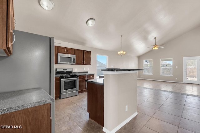 kitchen with light tile patterned floors, stainless steel appliances, and plenty of natural light
