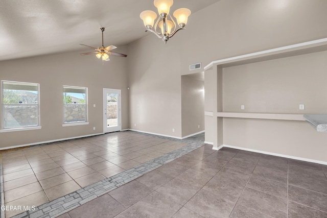 unfurnished living room featuring tile patterned floors, visible vents, high vaulted ceiling, ceiling fan with notable chandelier, and baseboards