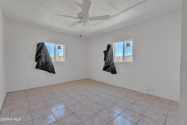 unfurnished room featuring ceiling fan
