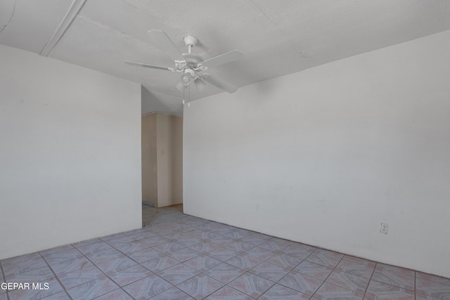 spare room with ceiling fan