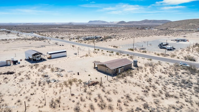 aerial view with a mountain view and view of desert
