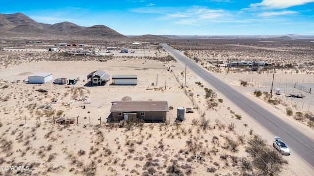 drone / aerial view with a mountain view and a desert view