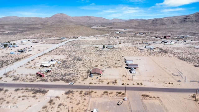 aerial view featuring a mountain view and view of desert
