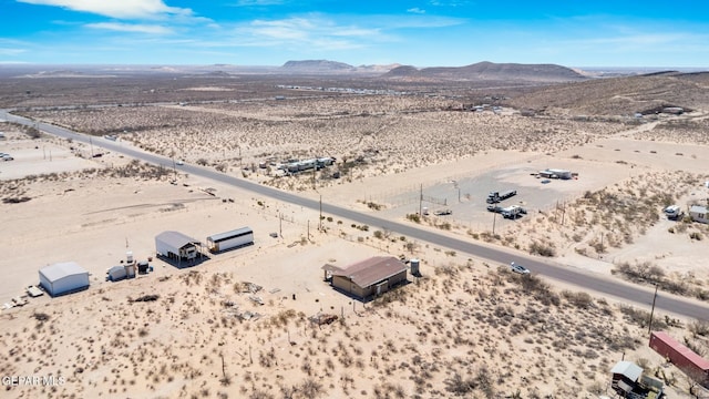 drone / aerial view with a mountain view and a desert view
