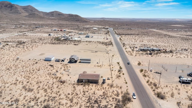 aerial view with a mountain view, a desert view, and a rural view