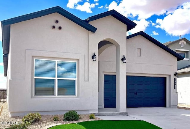 3897 Surmise St, El Paso, TX 79938 - view of front of house with concrete driveway, stucco siding, and an attached garage
