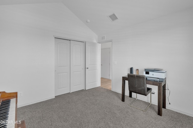 carpeted office featuring visible vents and high vaulted ceiling