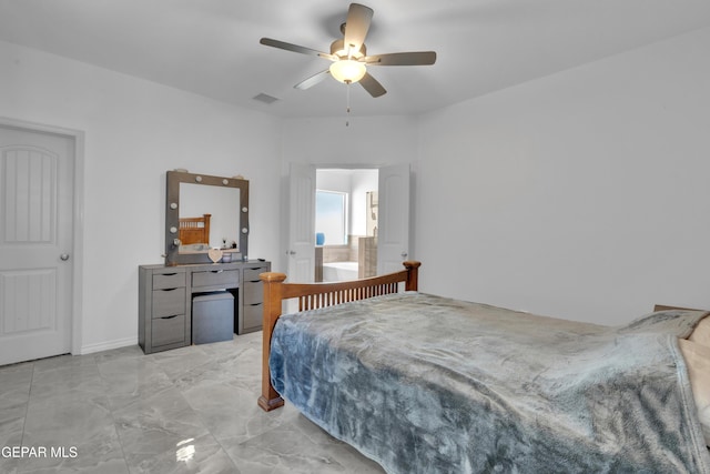 bedroom featuring visible vents, a ceiling fan, and marble finish floor