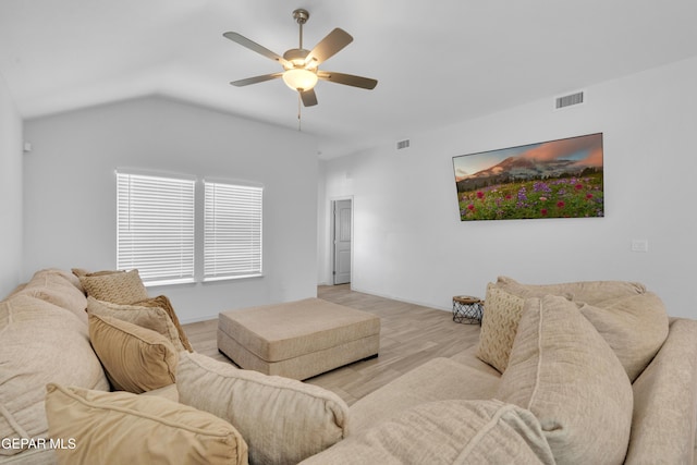 living room featuring wood finished floors, visible vents, a ceiling fan, and vaulted ceiling