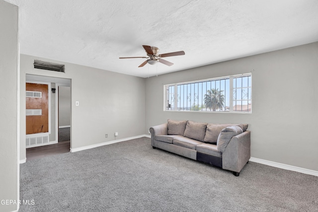 2413 Copper Ave Unit 79930, El Paso, TX 79930 - living room with carpet flooring, ceiling fan, baseboards, and a textured ceiling