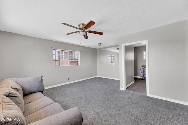 2413 Copper Ave Unit 79930, El Paso, TX 79930 - living area featuring carpet, ceiling fan, and baseboards