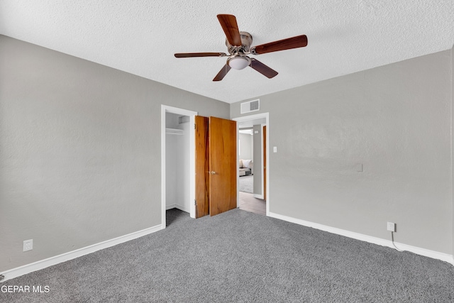 2413 Copper Ave Unit 79930, El Paso, TX 79930 - unfurnished bedroom with carpet floors, baseboards, a textured ceiling, a closet, and a ceiling fan