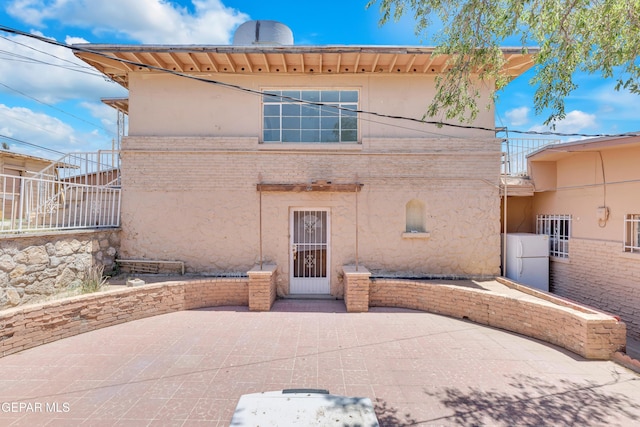 2413 Copper Ave Unit 79930, El Paso, TX 79930 - rear view of house featuring a patio and stucco siding