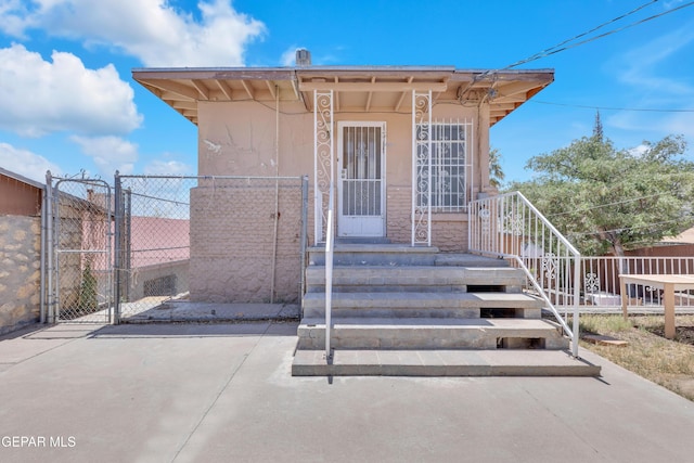 2413 Copper Ave Unit 79930, El Paso, TX 79930 - doorway to property featuring fence and a gate