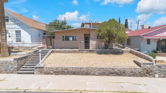 2413 Copper Ave Unit 79930, El Paso, TX 79930 - view of front of home with stairs and stucco siding