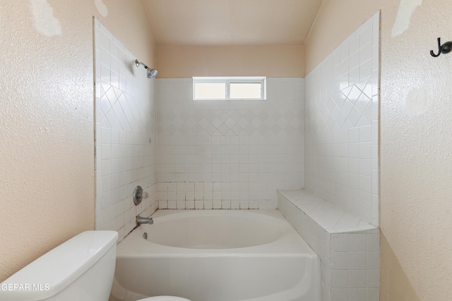 10892 Reef Sands Dr, El Paso, TX 79924 - full bath with a textured wall, toilet, and shower / tub combination
