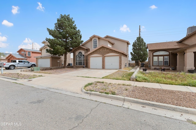 10892 Reef Sands Dr, El Paso, TX 79924 - view of front of property featuring central AC, concrete driveway, and a garage