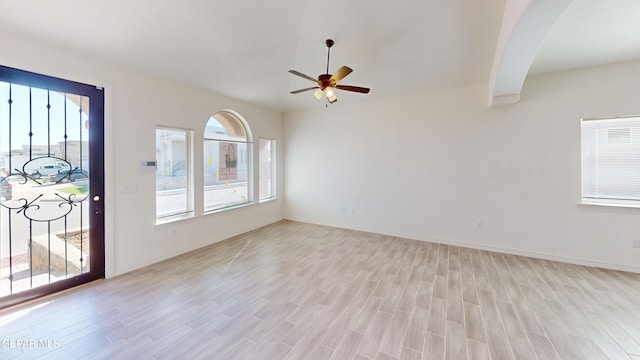 2237 Tony Harper St, El Paso, TX 79938 - interior space featuring baseboards, a wealth of natural light, light wood-type flooring, and a ceiling fan