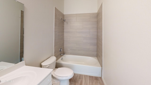 2237 Tony Harper St, El Paso, TX 79938 - full bath featuring shower / bathing tub combination, wood tiled floor, toilet, and vanity