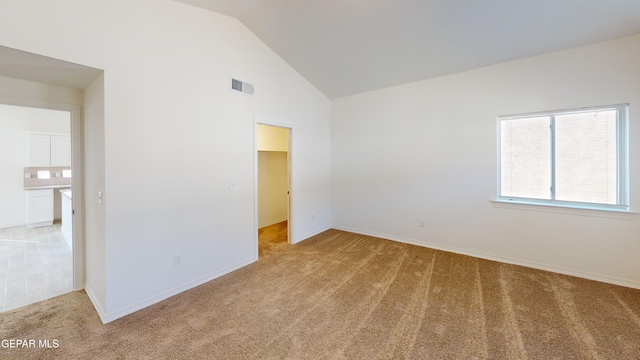 2237 Tony Harper St, El Paso, TX 79938 - unfurnished bedroom featuring high vaulted ceiling, a spacious closet, baseboards, light colored carpet, and visible vents