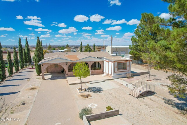 view of front of house featuring fence