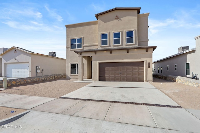 13095 Emerald Isle St, El Paso, TX 79928 - view of front of house featuring stucco siding, an attached garage, and concrete driveway
