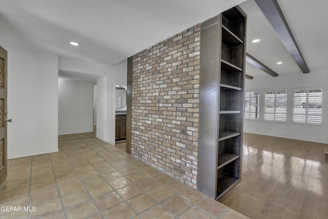 4945 Vista Grande Cir, El Paso, TX 79922 - interior space featuring recessed lighting, a textured ceiling, beam ceiling, brick wall, and built in features