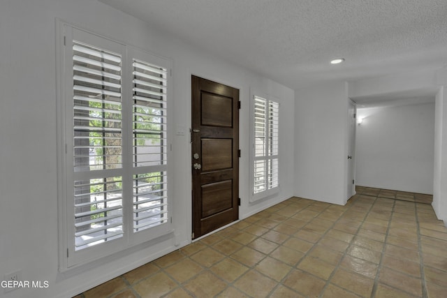4945 Vista Grande Cir, El Paso, TX 79922 - entrance foyer with a textured ceiling, recessed lighting, and plenty of natural light